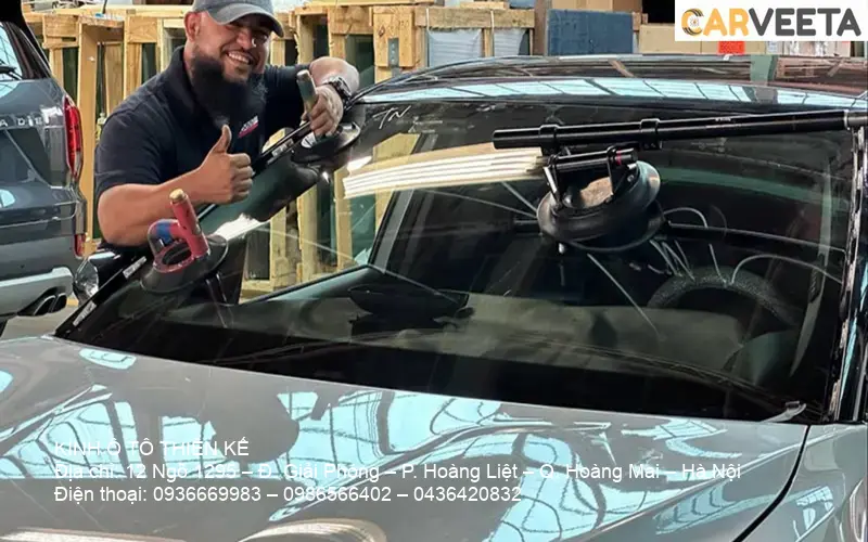 Car window glass being repaired