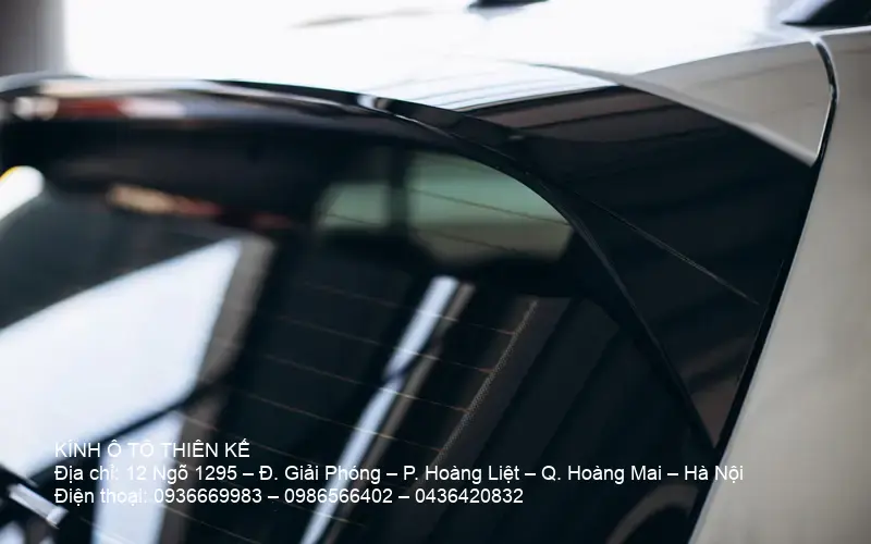 Close-up image of car roof and spoiler relevant for auto glass fitting