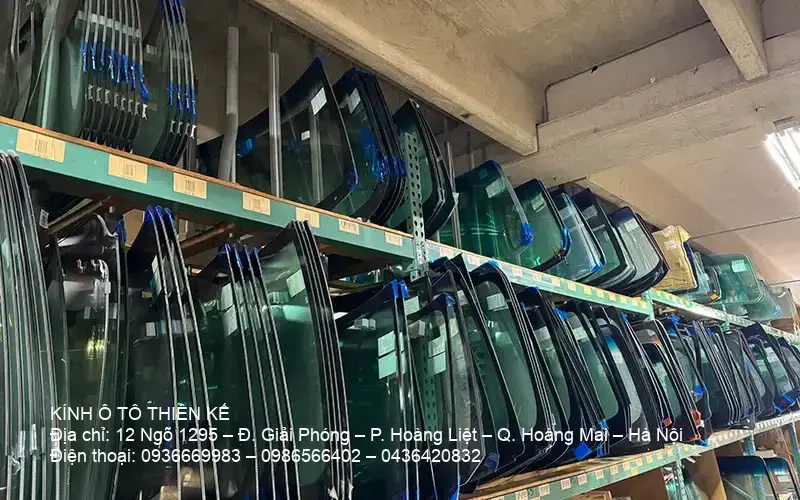 Assorted windshields stacked in inventory